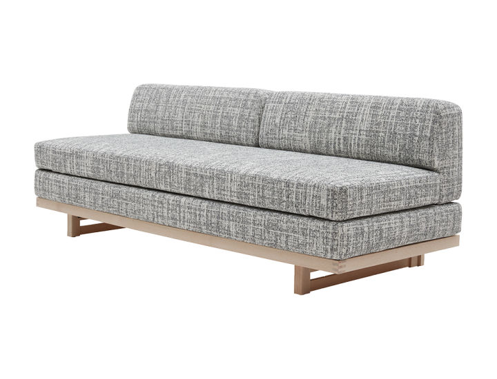 Canapé-lit ZENZO Softline design minimaliste avec cadre bois sur fond blanc.